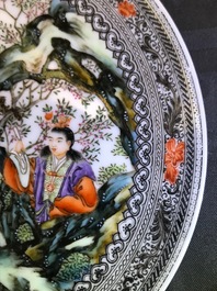 A Chinese famille rose plate with figures in a garden, Republic, 20th C.
