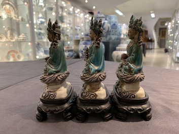 Three Chinese enamel on biscuit figures of Buddha, 19th C.