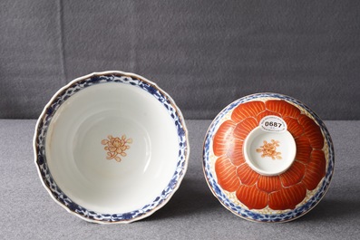 A Chinese blue, white and iron red bowl and cover on stand, Qianlong/Jiaqing