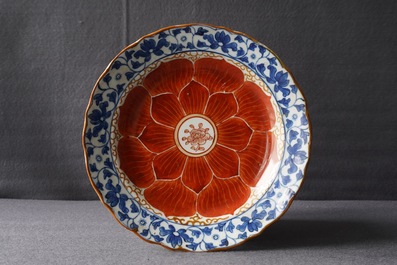 A Chinese blue, white and iron red bowl and cover on stand, Qianlong/Jiaqing