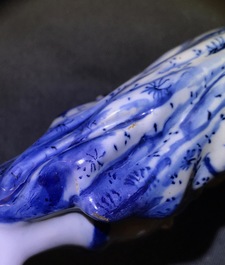 A pair of Dutch Delft blue and white models hurdy-gurdy players, 18th C.