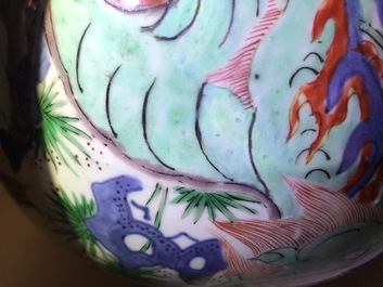 A Chinese wucai &lsquo;mythical beasts&rsquo; vase and cover, Transitional period