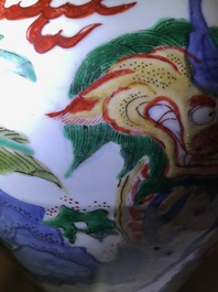 A Chinese wucai &lsquo;mythical beasts&rsquo; vase and cover, Transitional period