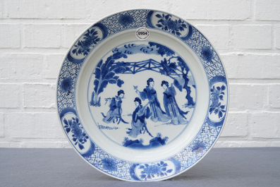 A Chinese blue and white dish with 'Long Eliza' playing music, Kangxi