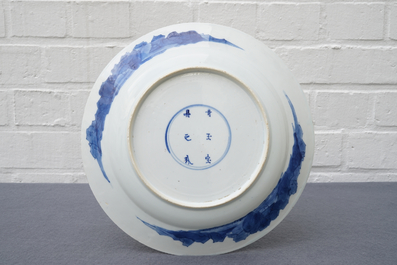 A Chinese blue and white dish with 'Long Eliza' playing music, Kangxi