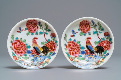 A pair of Chinese famille rose 'roosters' cups and saucers, Yongzheng/Qianlong