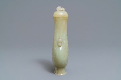 A Chinese archaic celadon jade vase and cover, 19th C.