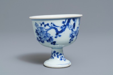 A Chinese blue and white stem cup with birds among blossoms, Transitional period