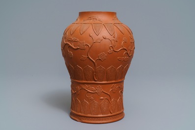 A Chinese Yixing stoneware baluster vase with applied design, Kangxi