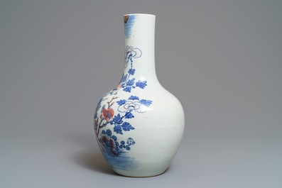 A Chinese blue, white and underglaze red 'rooster' vase, 19th C.