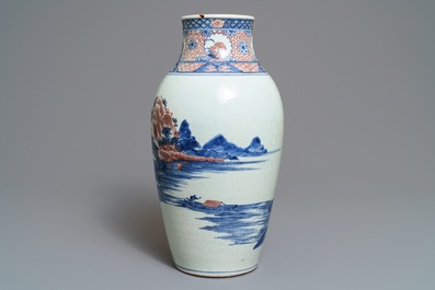 A Chinese blue, white and underglaze red landscape vase, 19th C.