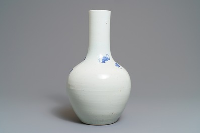 A Chinese blue, white and underglaze red 'rooster' vase, 19th C.