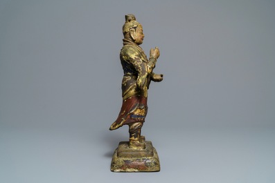 A large Chinese cold-painted bronze figure of a guardian, Ming