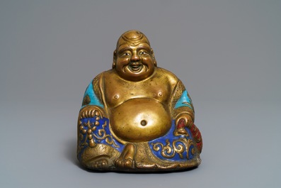 A Chinese champlev&eacute; enamelled copper figure of Buddha, Qianlong