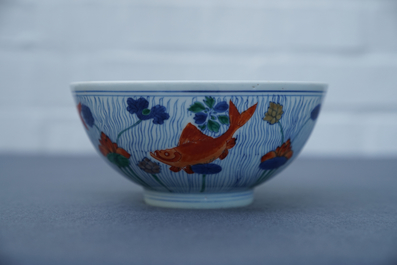 A Chinese doucai bowl with fish in a lotus pond, Xuande mark, Kangxi