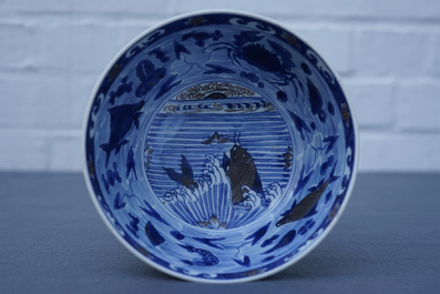 A rare Chinese blue and underglaze red bowl with carps and marine animals, Xuande mark, Kangxi