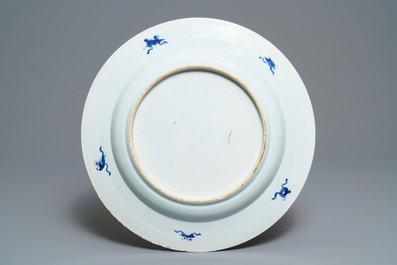 A large Chinese blue and white 'peacock border' dish, Kangxi