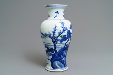 A Chinese blue and white 'river landscape' baluster vase with overglaze accents, Kangxi