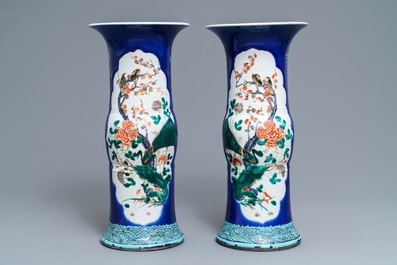 A pair of Chinese famille verte powder blue-ground gu vases, Kangxi mark, 19th C.