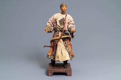 A Chinese Manchu archer doll in painted wood and textile, 19th C.