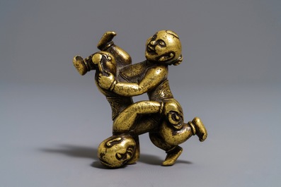 A Chinese gilt bronze Hoho brothers scroll weight, 18/19th C.