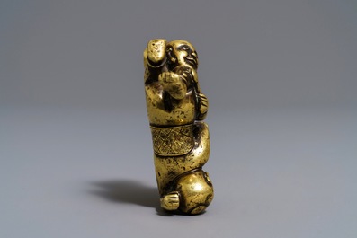A Chinese gilt bronze Hoho brothers scroll weight, 18/19th C.