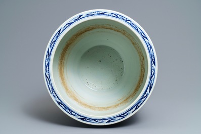 A Chinese blue and white fish bowl with landscape panels, 19th C.
