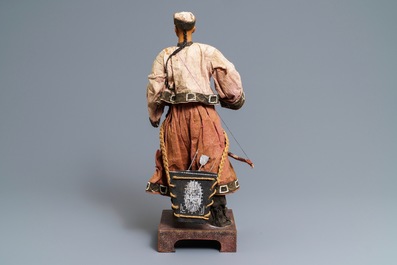 A Chinese Manchu archer doll in painted wood and textile, 19th C.