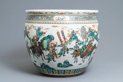 A large Chinese famille verte fish bowl with a narrative scene all-round, 19th C.