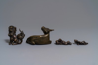 Four Chinese bronze scroll weights, 18/19th C.