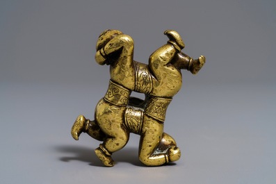 A Chinese gilt bronze Hoho brothers scroll weight, 18/19th C.