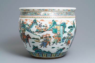 A large Chinese famille verte fish bowl with a narrative scene all-round, 19th C.