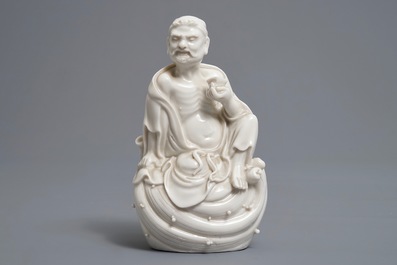 Two Chinese Dehua blanc de Chine models of a Luohan and Guanyin with servant, 19th C.