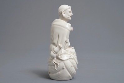 Two Chinese Dehua blanc de Chine models of a Luohan and Guanyin with servant, 19th C.