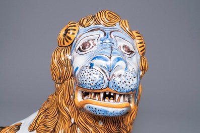 A massive French faience model of a lion, Rouen, 19th C