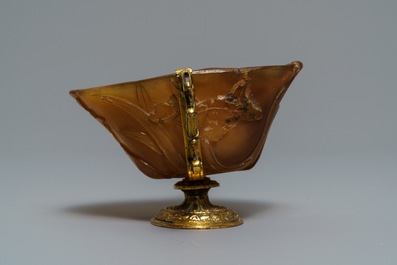 A Chinese gilt brass-mounted carved horn libation cup, 18/19th C.
