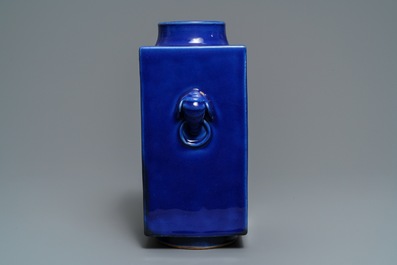 A Chinese calligraphy plaque dated 1947 and a monochrome blue cong vase, 19th C.