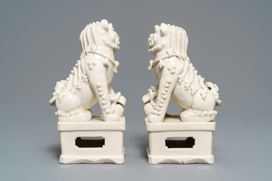 A pair of large Chinese Dehua blanc de Chine models of buddhist lions, Kangxi