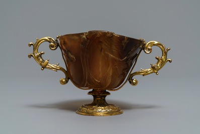 A Chinese gilt brass-mounted carved horn libation cup, 18/19th C.