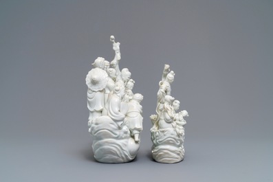 Two Chinese Dehua blanc de Chine groups with immortals on log boats, 19th C.