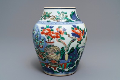 A Chinese wucai vase with vases in a garden, Transitional period