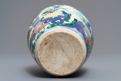 A Chinese wucai vase with vases in a garden, Transitional period