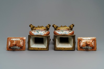 A pair of large Chinese ormolu-mounted famille rose 'mandarin' vases and covers, Qianlong