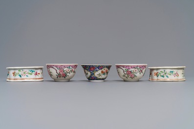 Three Chinese famille rose cups and saucers and a pair of salts, Qianlong and later