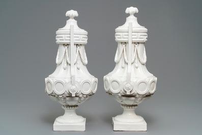 A pair of tall neoclassical Sevres-style covered vases, France or Germany, 18/19th C.