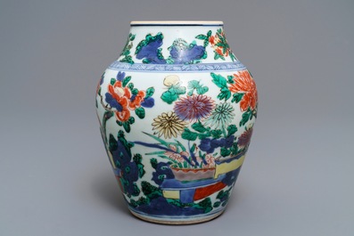 A Chinese wucai vase with vases in a garden, Transitional period