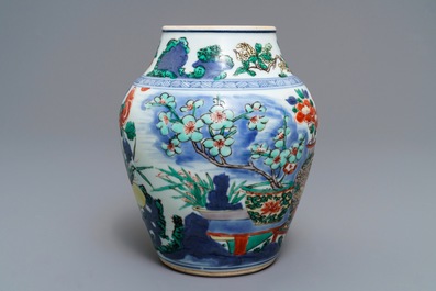A Chinese wucai vase with vases in a garden, Transitional period