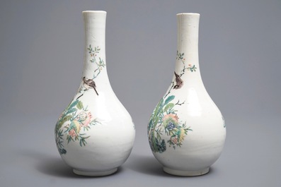 A pair of Chinese famille rose bottle vases with birds and flowers, Yongzheng