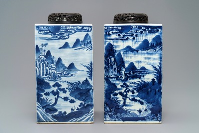 A pair of tall Chinese blue and white tea caddies with landscapes, 19th C.