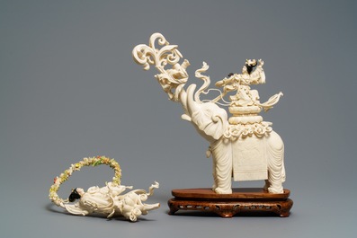 A large Chinese ivory group of an elephant with two ladies, 1st half 20th C.